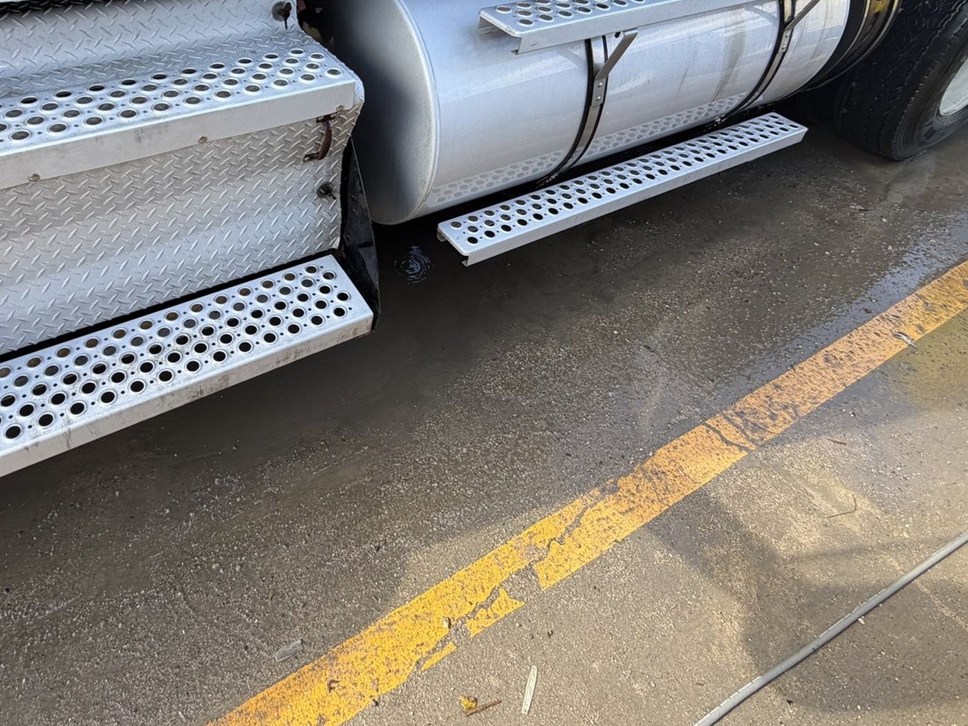 Same fuel tank and steps after detailing, polished clean