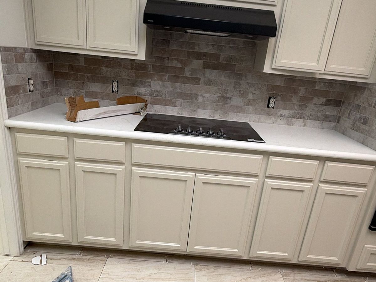 Kitchen with subway tile backsplash and new floor tile