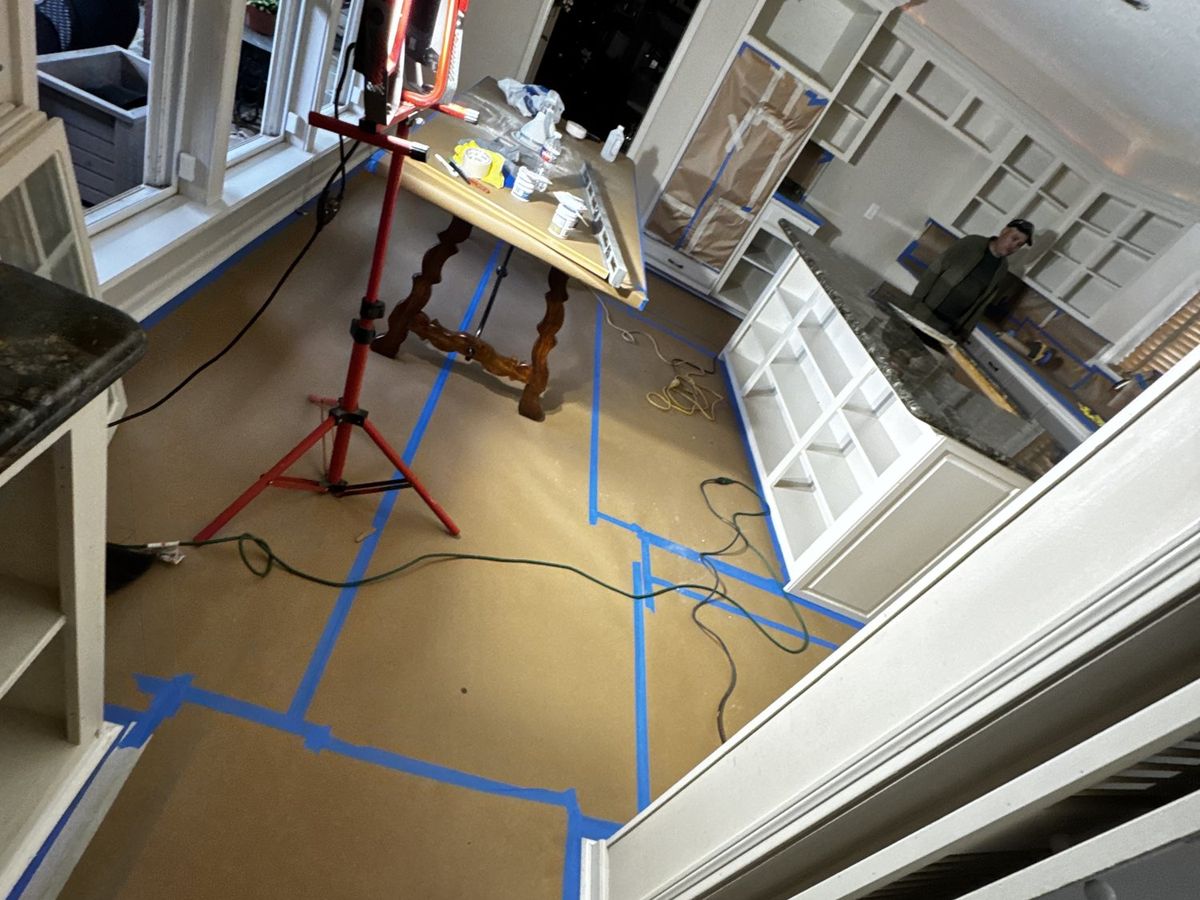 Floors and cabinets masked before the scrape