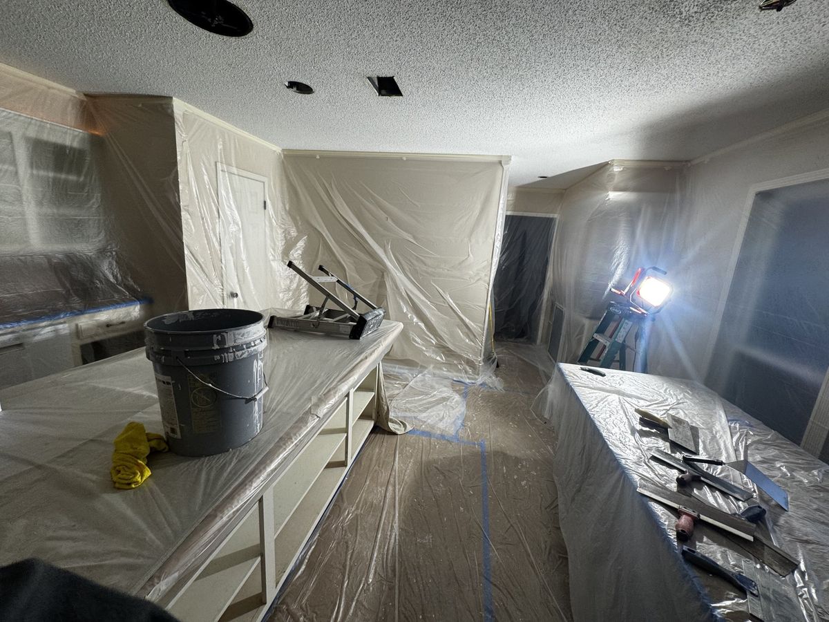 Room sealed off, popcorn ceiling removed