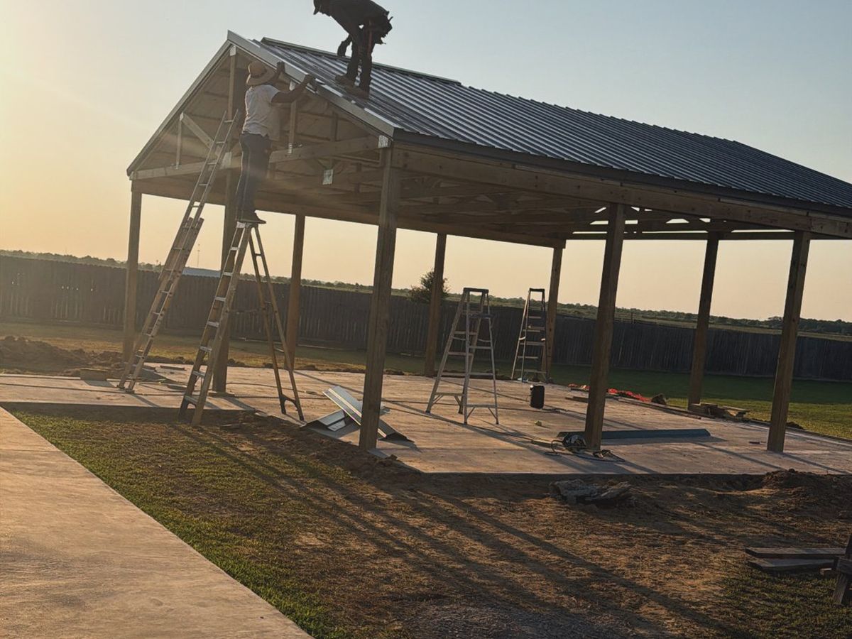 Outdoor pavilion with metal roof being installed