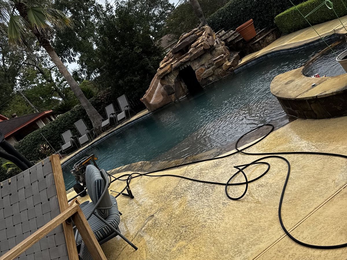 Washing the deck around the pool