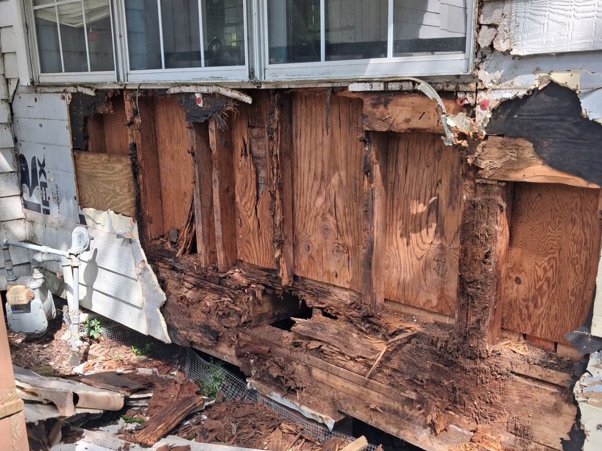 Before — rotted exterior wall